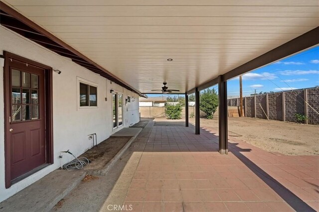 view of patio featuring ceiling fan