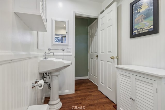 bathroom with hardwood / wood-style flooring