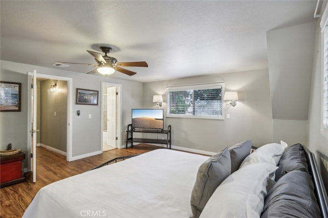 bedroom with connected bathroom, wood-type flooring, and ceiling fan