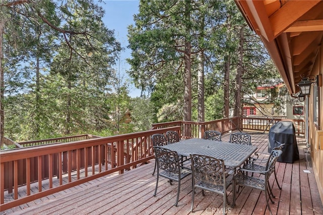 wooden deck with grilling area