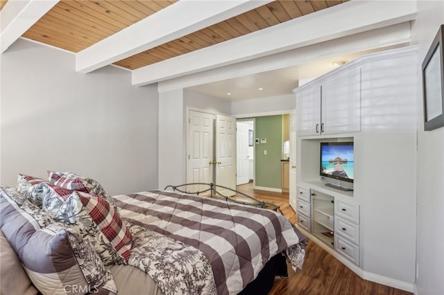 bedroom with wood ceiling, dark hardwood / wood-style floors, and beamed ceiling