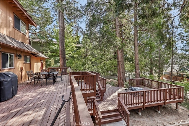 wooden deck with grilling area