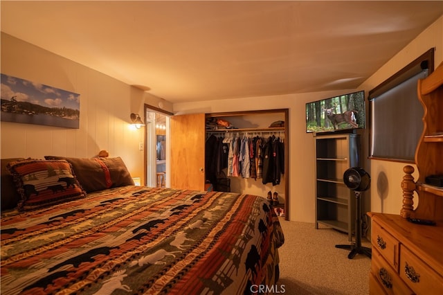 bedroom with light colored carpet and a closet