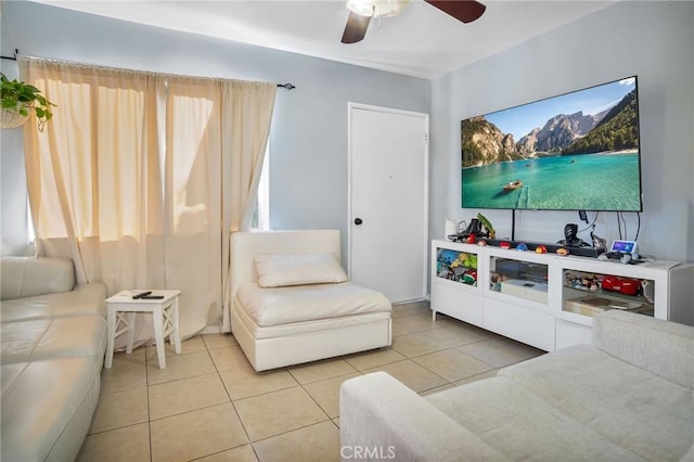 living room featuring ceiling fan and tile patterned flooring