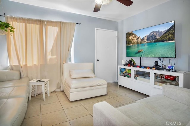 living room featuring ceiling fan and tile patterned flooring