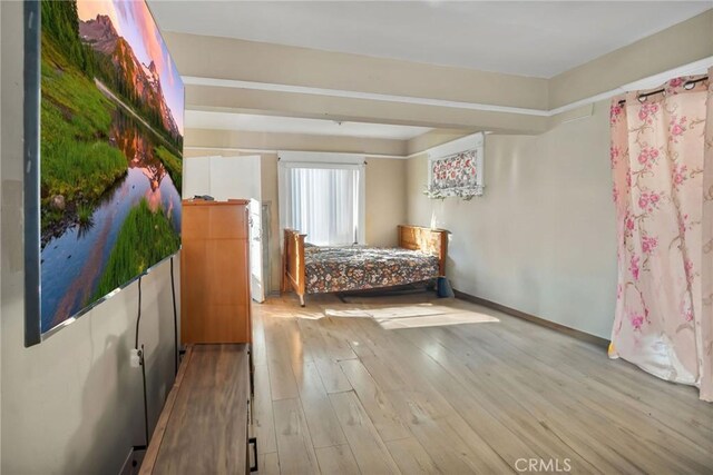 unfurnished bedroom with light hardwood / wood-style floors