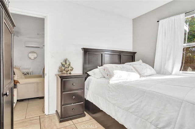 tiled bedroom with a wall unit AC