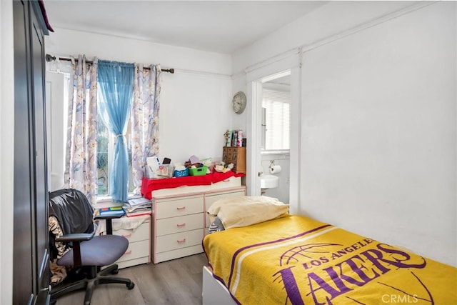 bedroom with light hardwood / wood-style floors