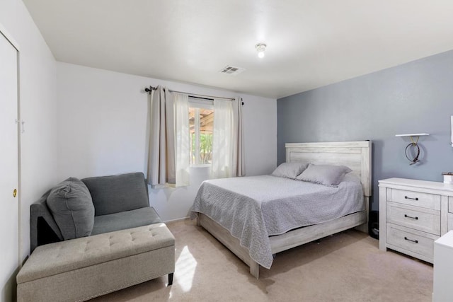 bedroom featuring light colored carpet