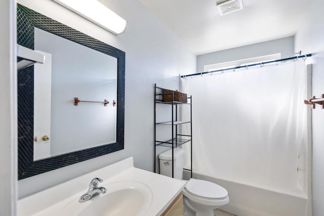 full bathroom with vanity, shower / bath combo with shower curtain, and toilet