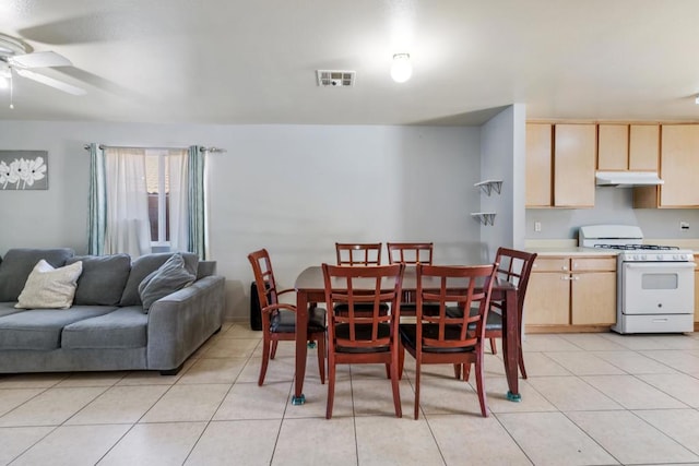 dining room featuring light tile patterned flooring and ceiling fan