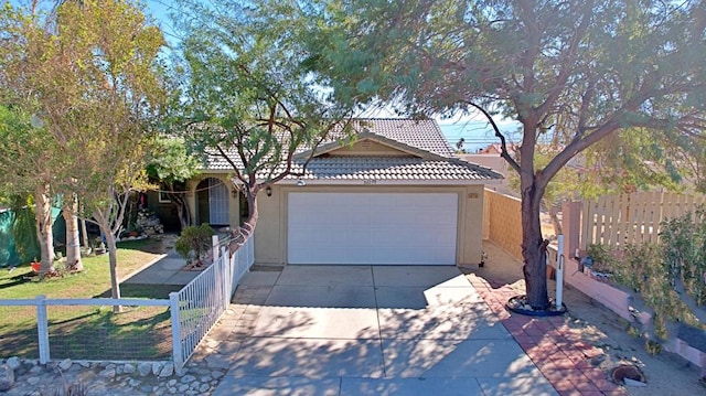 ranch-style house featuring a front yard and a garage