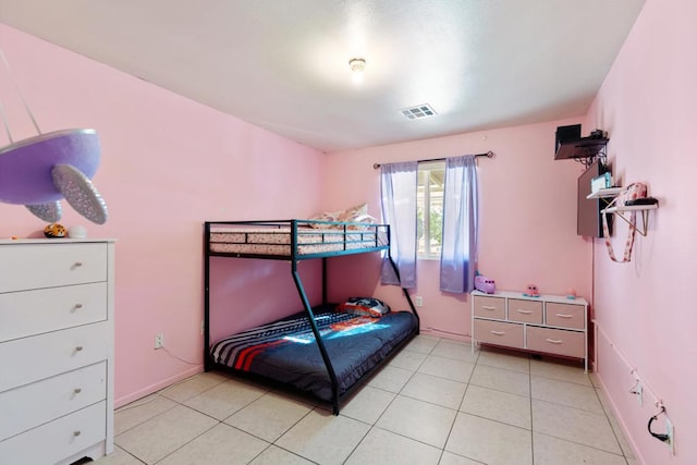 bedroom with light tile patterned flooring