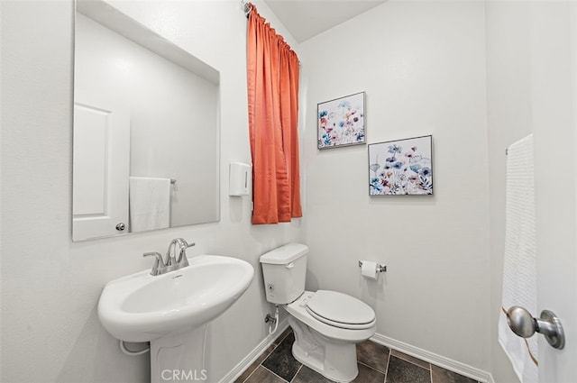 bathroom with toilet and sink