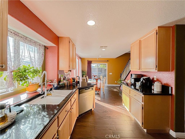 kitchen featuring a textured ceiling, dark wood-type flooring, sink, light brown cabinets, and dishwasher