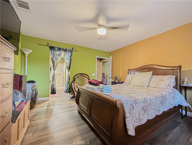 bedroom featuring ceiling fan and wood-type flooring