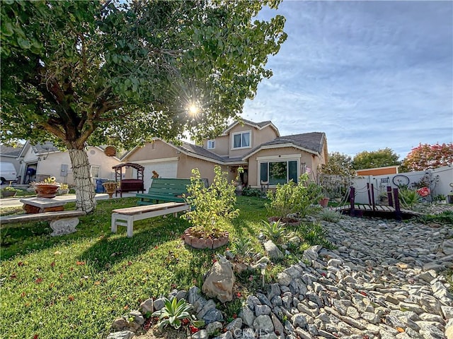 view of front of property with a garage and a front lawn