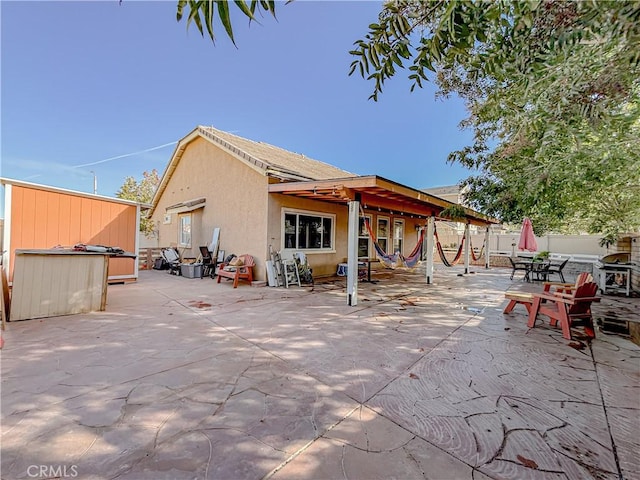 rear view of house featuring a patio area