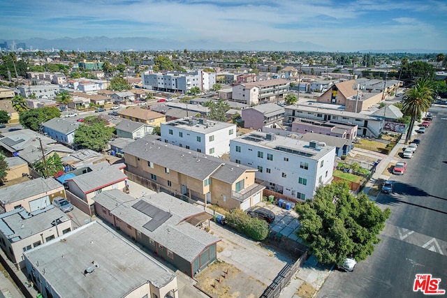 birds eye view of property featuring a mountain view