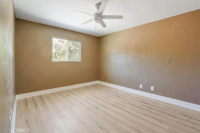 unfurnished room with ceiling fan and light hardwood / wood-style flooring