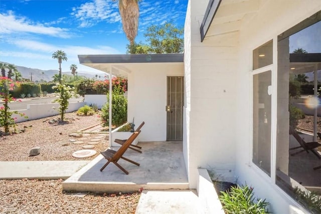 exterior space featuring a patio area and a mountain view