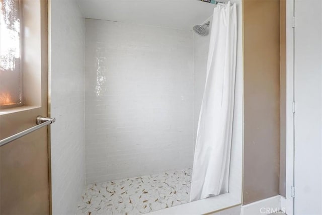 bathroom featuring walk in shower