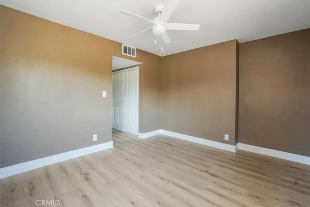 unfurnished room with light hardwood / wood-style floors and ceiling fan