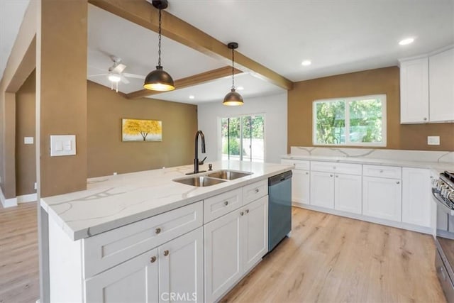 kitchen with sink, white cabinetry, hanging light fixtures, an island with sink, and stainless steel appliances