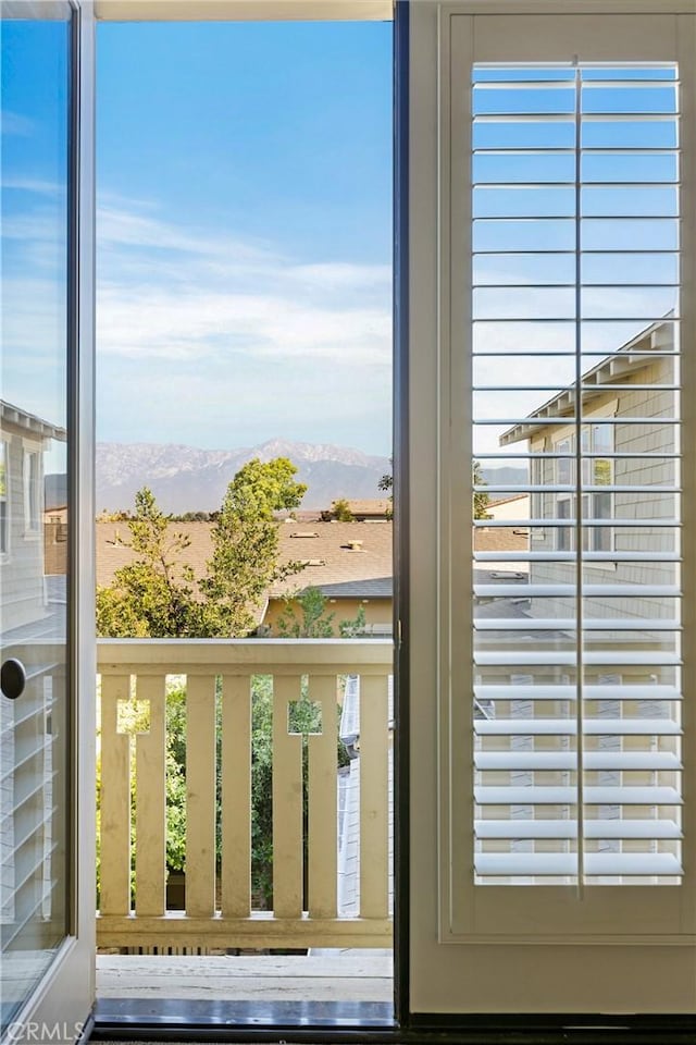 doorway to outside featuring hardwood / wood-style floors and a mountain view