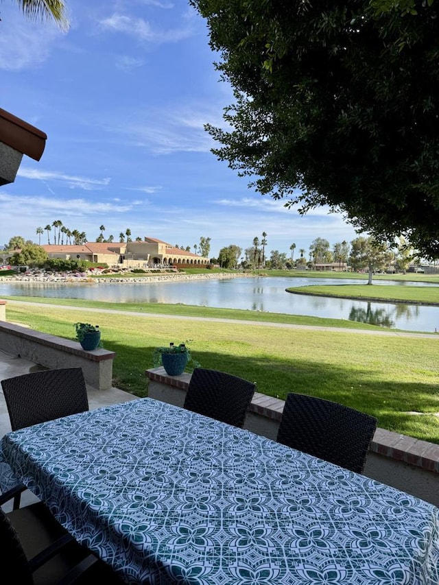 view of patio with a water view