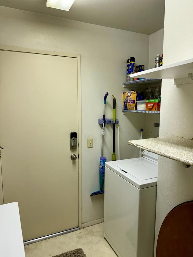 clothes washing area with washer / clothes dryer