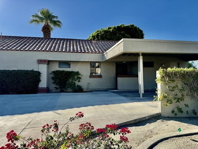 rear view of house with a carport