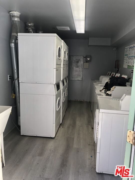 laundry area featuring dark hardwood / wood-style flooring, separate washer and dryer, and stacked washer / dryer