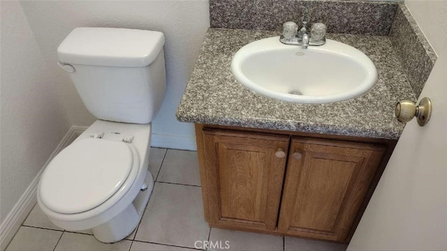 bathroom with tile patterned floors, vanity, and toilet