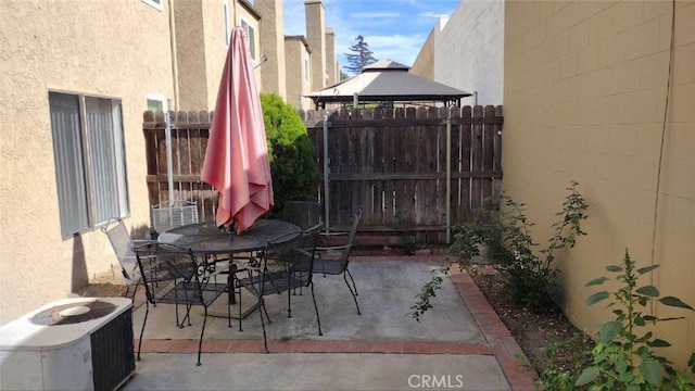 view of patio / terrace with a gazebo and central air condition unit