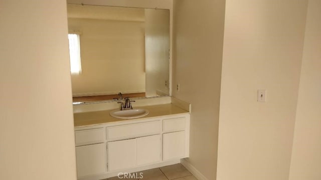 bathroom with tile patterned flooring and vanity