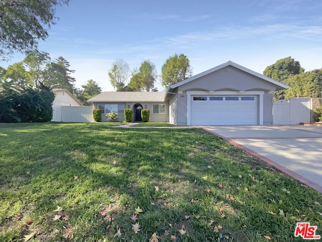 ranch-style house with a front lawn and a garage