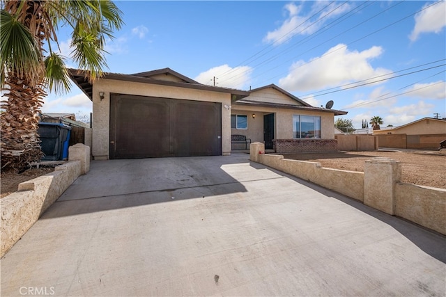 ranch-style home featuring a garage