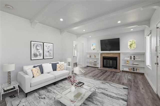 living room featuring beam ceiling and wood-type flooring