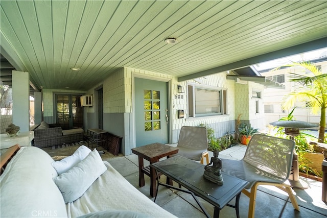 view of patio with a wall mounted AC