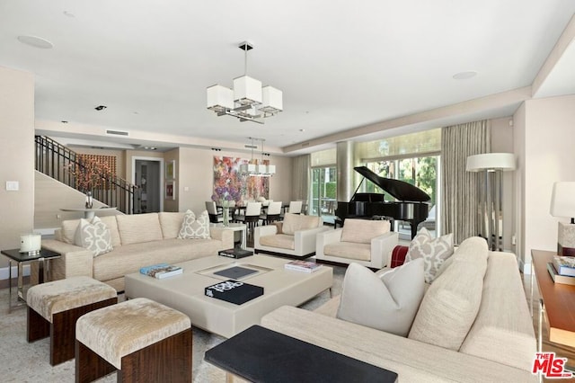 living room with an inviting chandelier