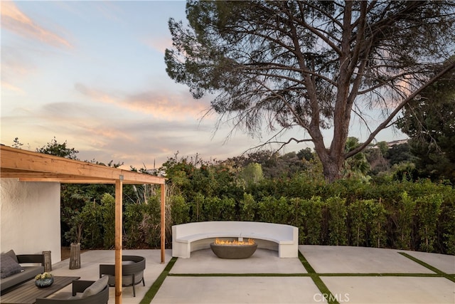 patio terrace at dusk with an outdoor fire pit