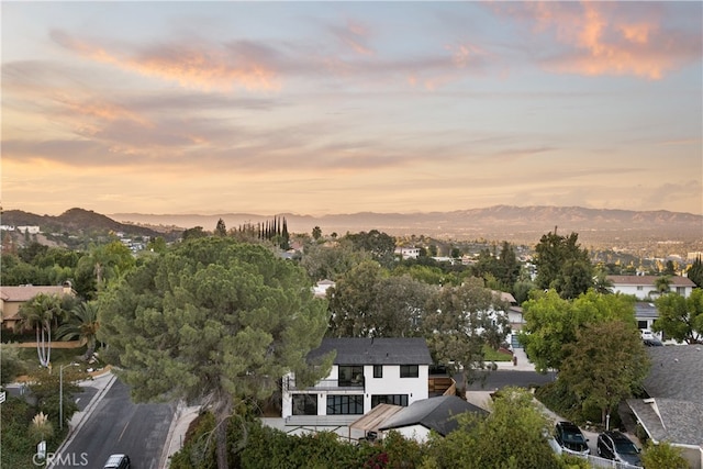 aerial view at dusk with a mountain view