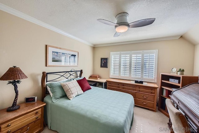 bedroom with lofted ceiling, ornamental molding, light colored carpet, a textured ceiling, and ceiling fan