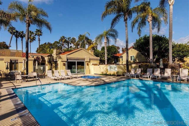 view of swimming pool with a patio area