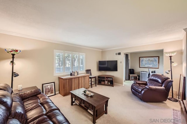 living room with light carpet and ornamental molding