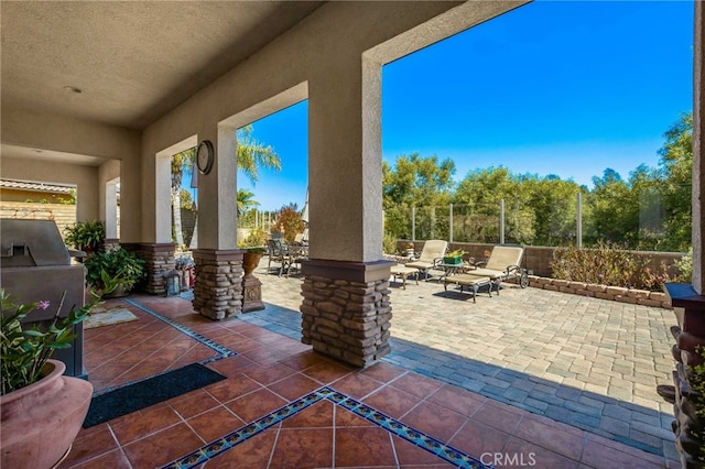 view of patio / terrace featuring outdoor dining space and fence