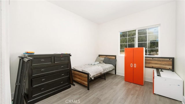 bedroom with light hardwood / wood-style floors