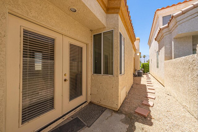 doorway to property featuring cooling unit