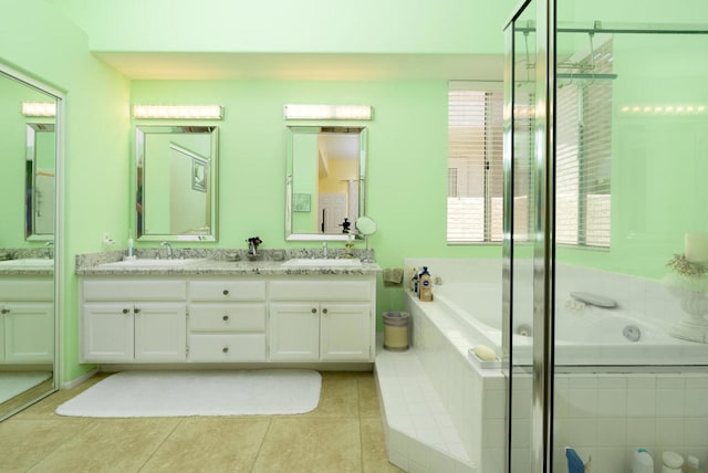 bathroom with vanity, shower with separate bathtub, and tile patterned flooring